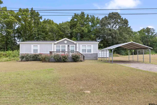 a house with trees in front of it