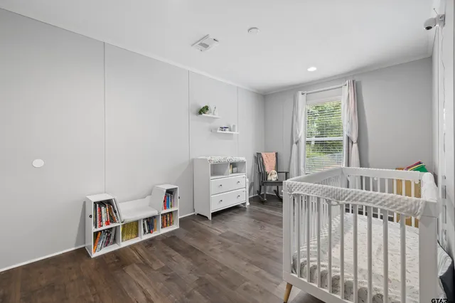 a bedroom with furniture and a window