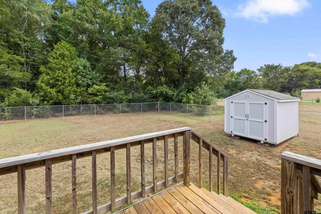 a balcony with trees in front of it