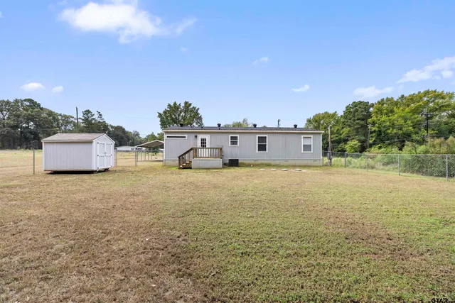 a large body of water with a building in the background