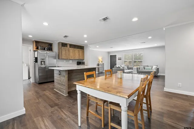 a kitchen with a table and chairs in it