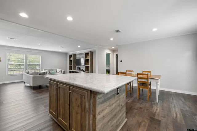 a kitchen with a table and chairs in it