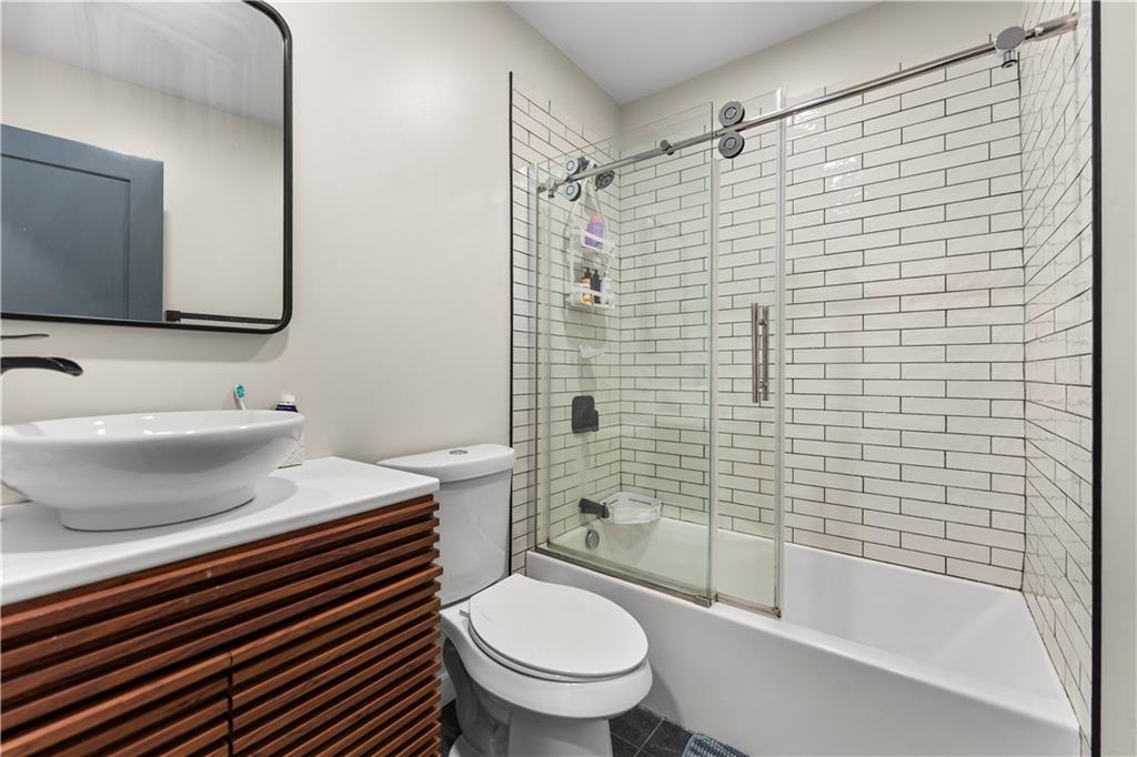 5322 Kent Way Pittsburgh, PA 15201 - Photo 12 of 24 a bathroom with a sink a toilet and shower