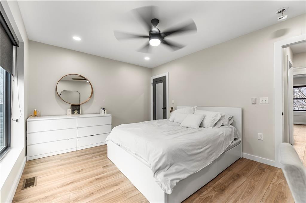 5322 Kent Way Pittsburgh, PA 15201 - Photo 13 of 24 a bedroom with a large bed and a chandelier