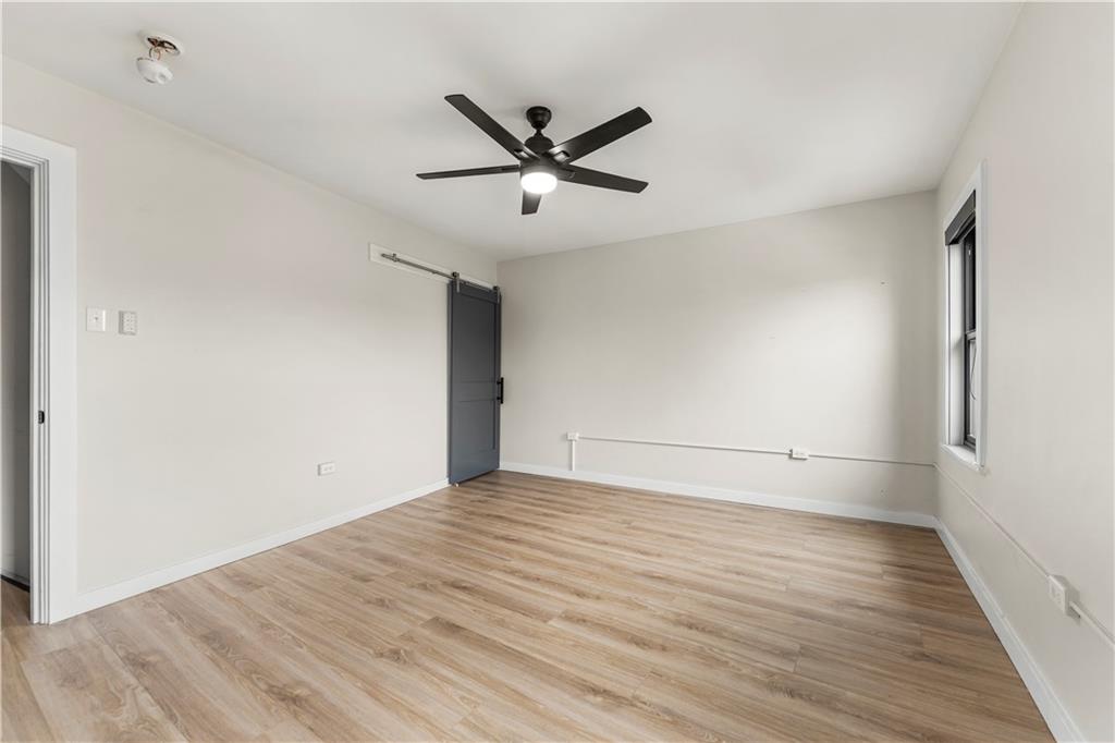 5322 Kent Way Pittsburgh, PA 15201 - Photo 18 of 24 a view of empty room with wooden floor and fan