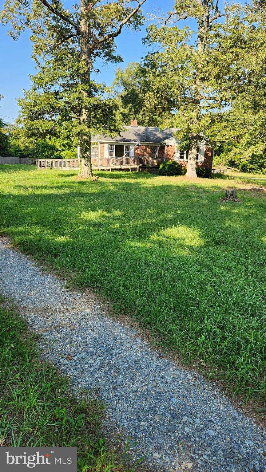 4499 Leonardtown Road Waldorf, MD 20601 - Photo 2 of 11 a view of yard with green space and trees in the background