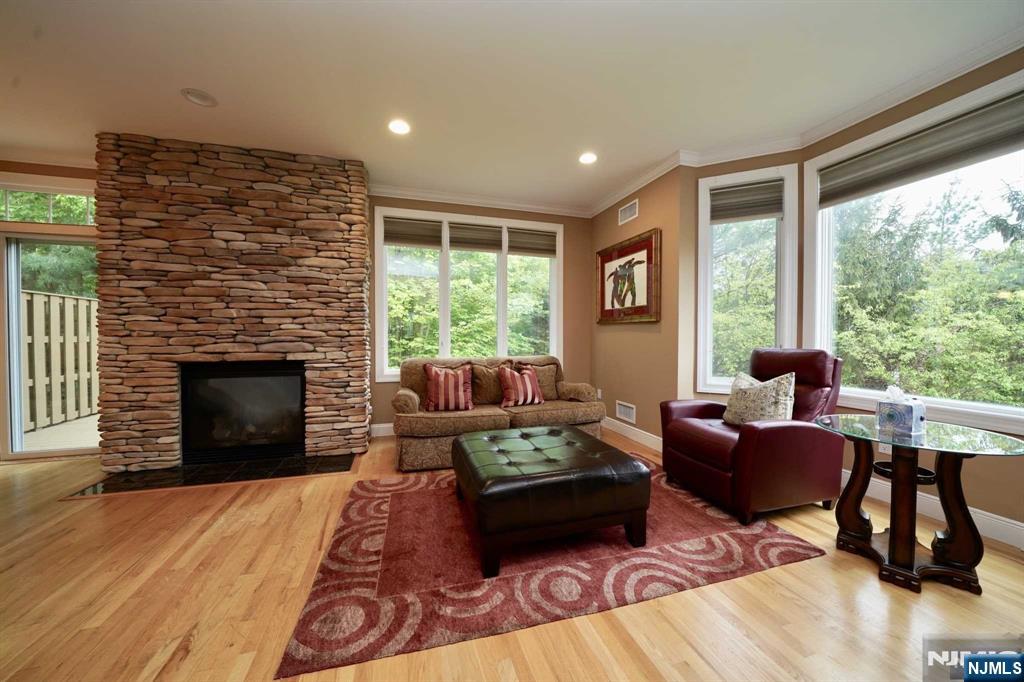 1 Candlewood Drive, Unit 1 Old Tappan, NJ 07675 - Photo 13 of 27 a living room with furniture and a fireplace