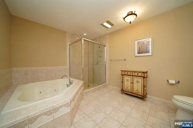 a bathroom with a bathtub and toilet