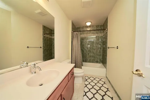 a bathroom with a sink and a shower