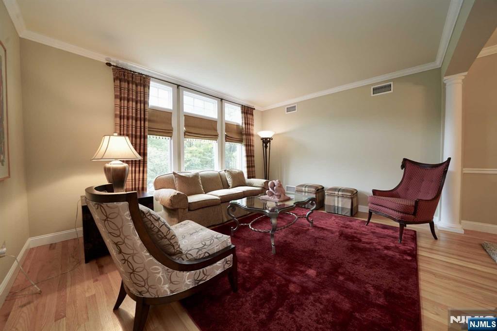 1 Candlewood Drive, Unit 1 Old Tappan, NJ 07675 - Photo 3 of 27 a living room with furniture and a window