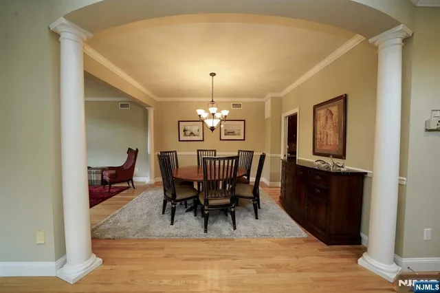 a view of a dining room with furniture and window