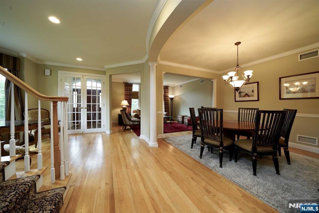 1 Candlewood Drive, Unit 1 Old Tappan, NJ 07675 - Photo 5 of 27 a view of a dining room with furniture window and wooden floor