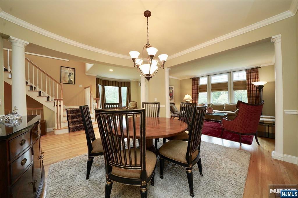 1 Candlewood Drive, Unit 1 Old Tappan, NJ 07675 - Photo 6 of 27 a view of a dining room with furniture and a chandelier