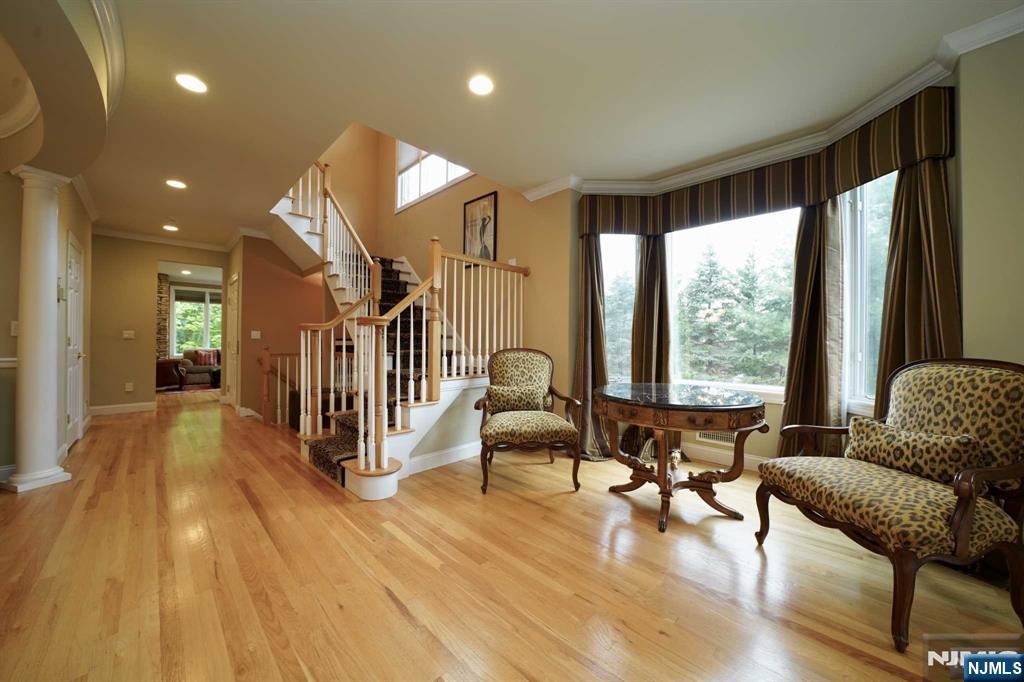 1 Candlewood Drive, Unit 1 Old Tappan, NJ 07675 - Photo 7 of 27 a living room with furniture and a large window