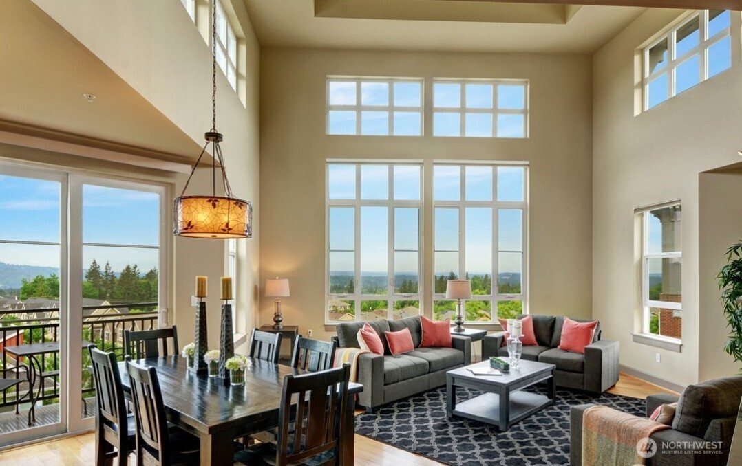 1840 25th Avenue Northeast, Unit 405 Issaquah, WA 98029 - Photo 1 of 20 a living room with furniture and floor to ceiling windows