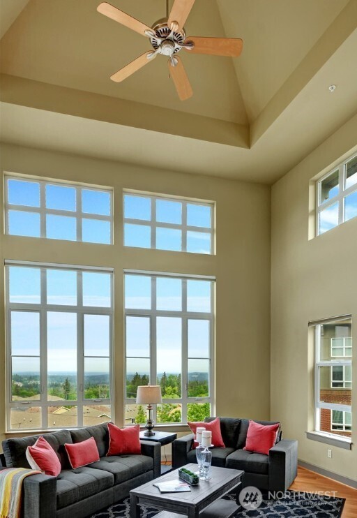 1840 25th Avenue Northeast, Unit 405 Issaquah, WA 98029 - Photo 7 of 20 a living room with furniture and floor to ceiling windows