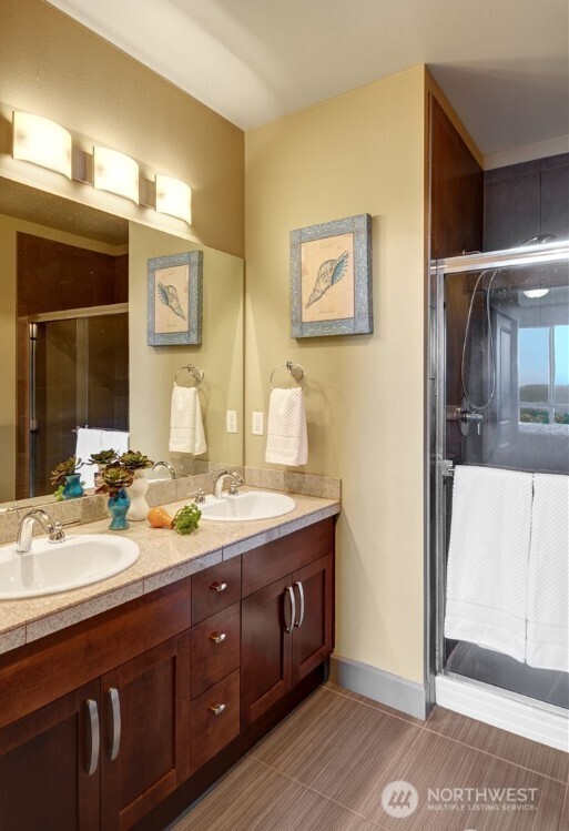 1840 25th Avenue Northeast, Unit 405 Issaquah, WA 98029 - Photo 9 of 20 a spacious bathroom with a double vanity sink and a mirror