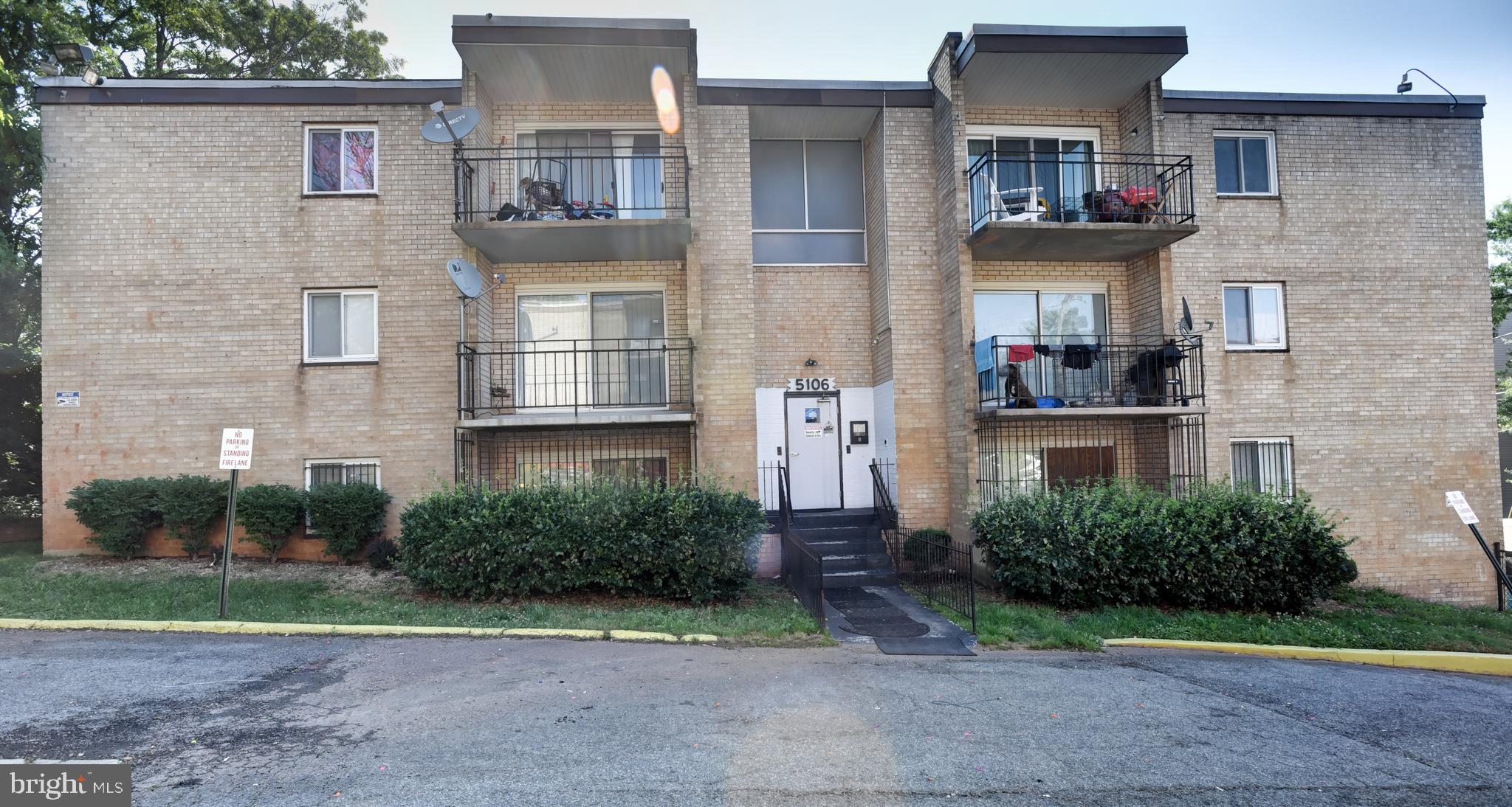 5106 F Street Southeast, Unit 8 Washington, DC 20019 - Photo 1 of 39 a front view of a house with garden
