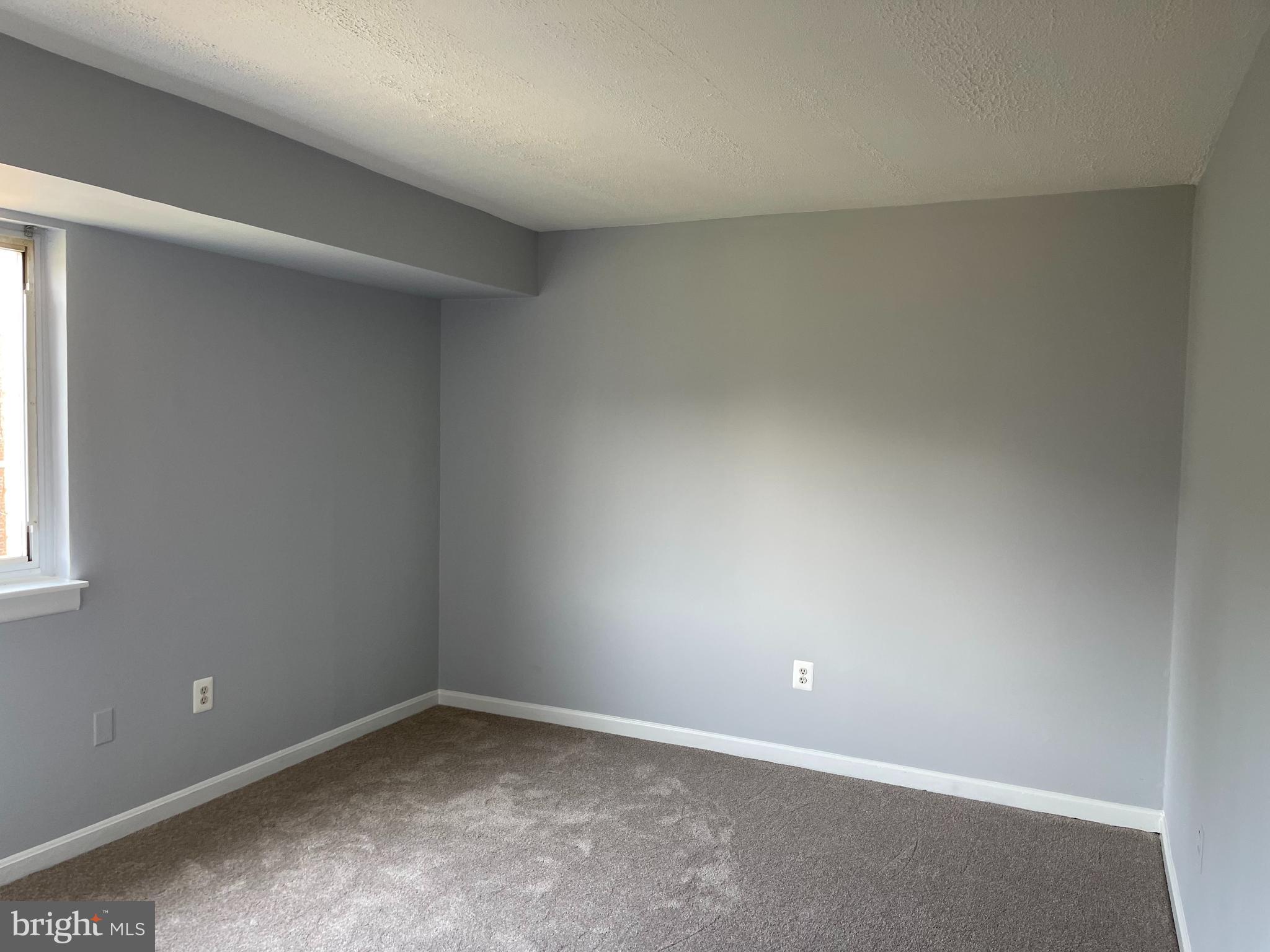 5106 F Street Southeast, Unit 8 Washington, DC 20019 - Photo 17 of 39 an empty room with a window