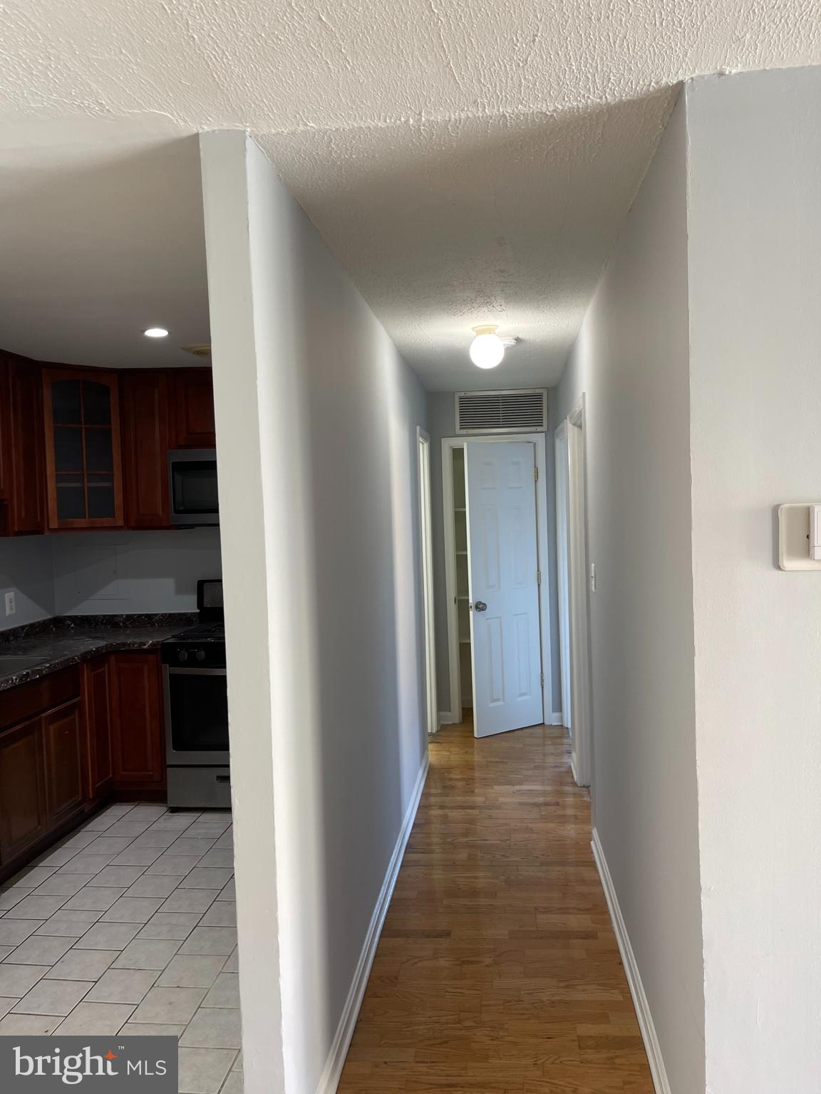 5106 F Street Southeast, Unit 8 Washington, DC 20019 - Photo 18 of 39 a view of a hallway to kitchen