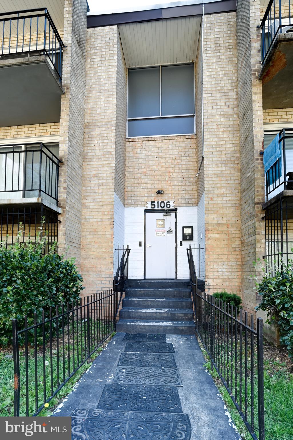 5106 F Street Southeast, Unit 8 Washington, DC 20019 - Photo 2 of 39 a view of a house with wooden fence