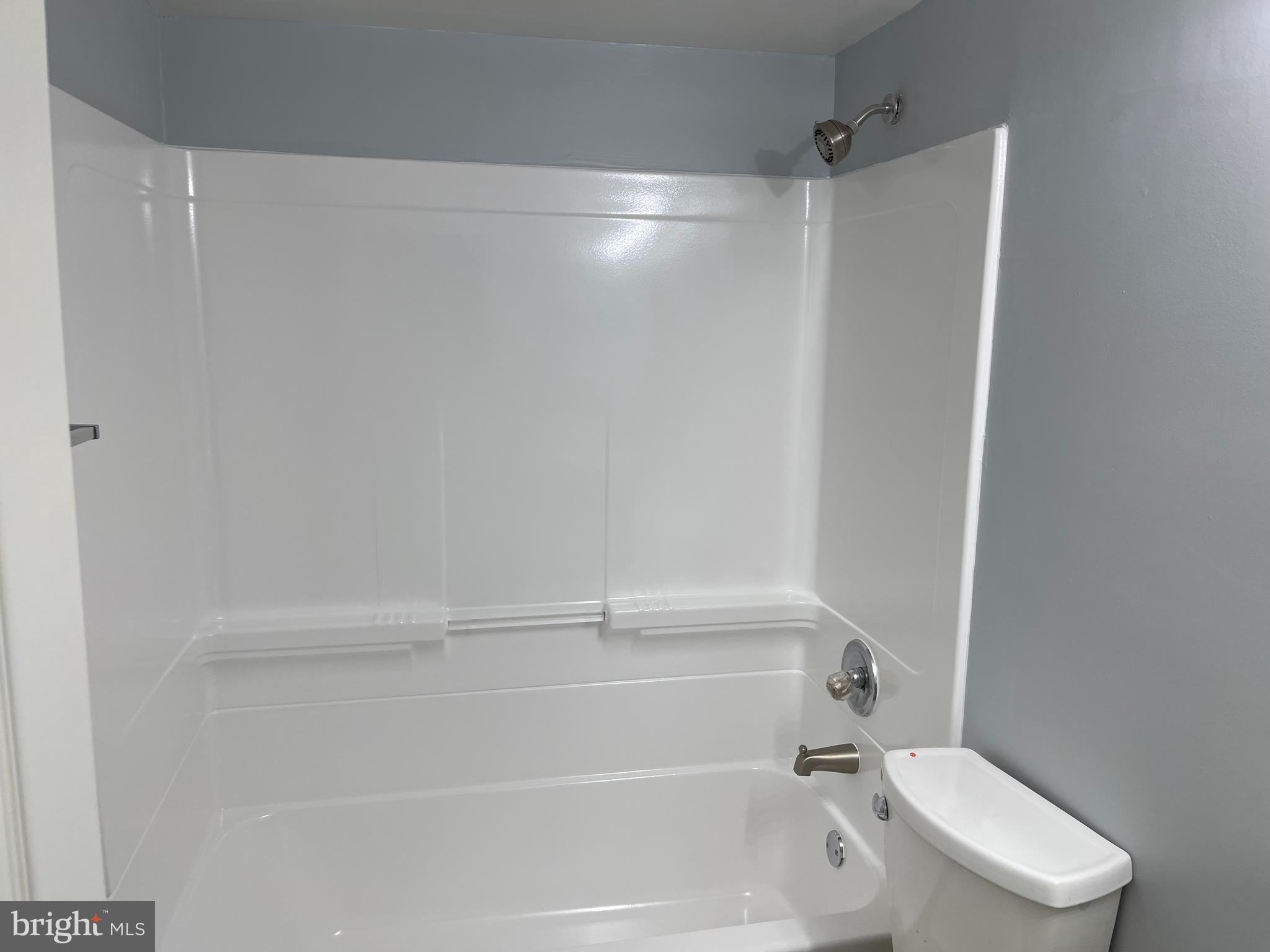 5106 F Street Southeast, Unit 8 Washington, DC 20019 - Photo 22 of 39 a bathroom with a shower and a toilet