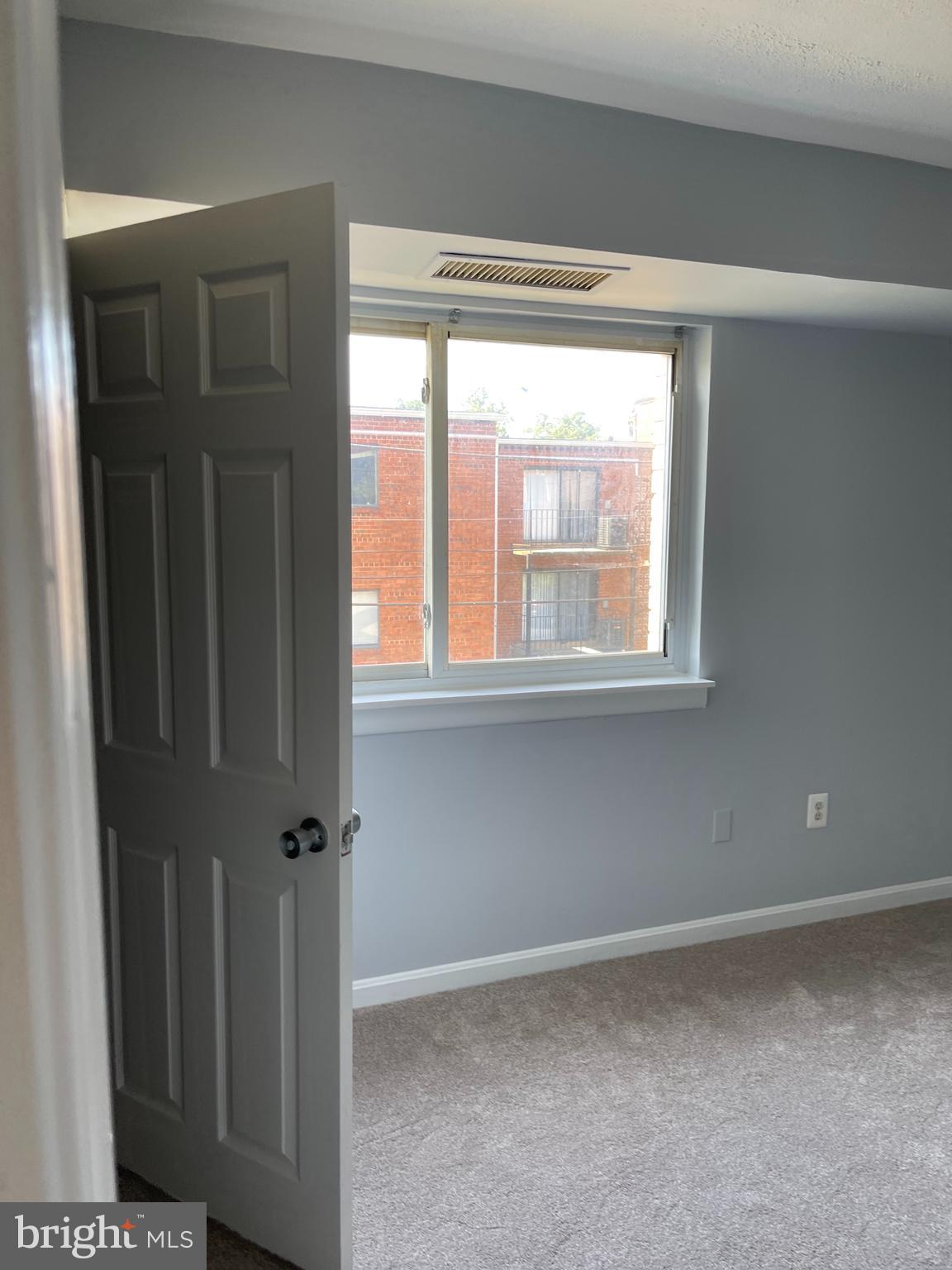 5106 F Street Southeast, Unit 8 Washington, DC 20019 - Photo 25 of 39 a view of an empty room with a window