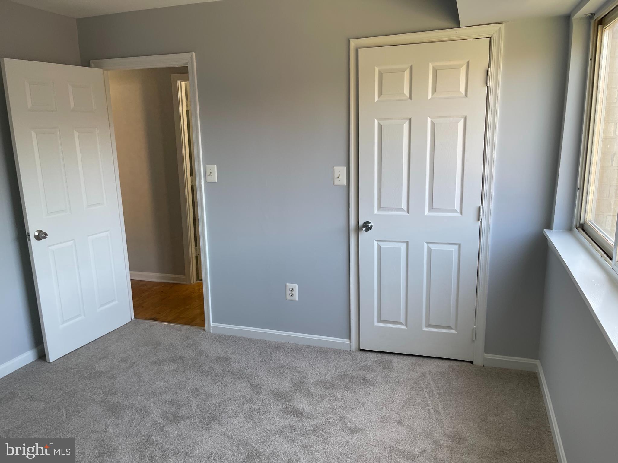 5106 F Street Southeast, Unit 8 Washington, DC 20019 - Photo 27 of 39 an empty room with windows and closet