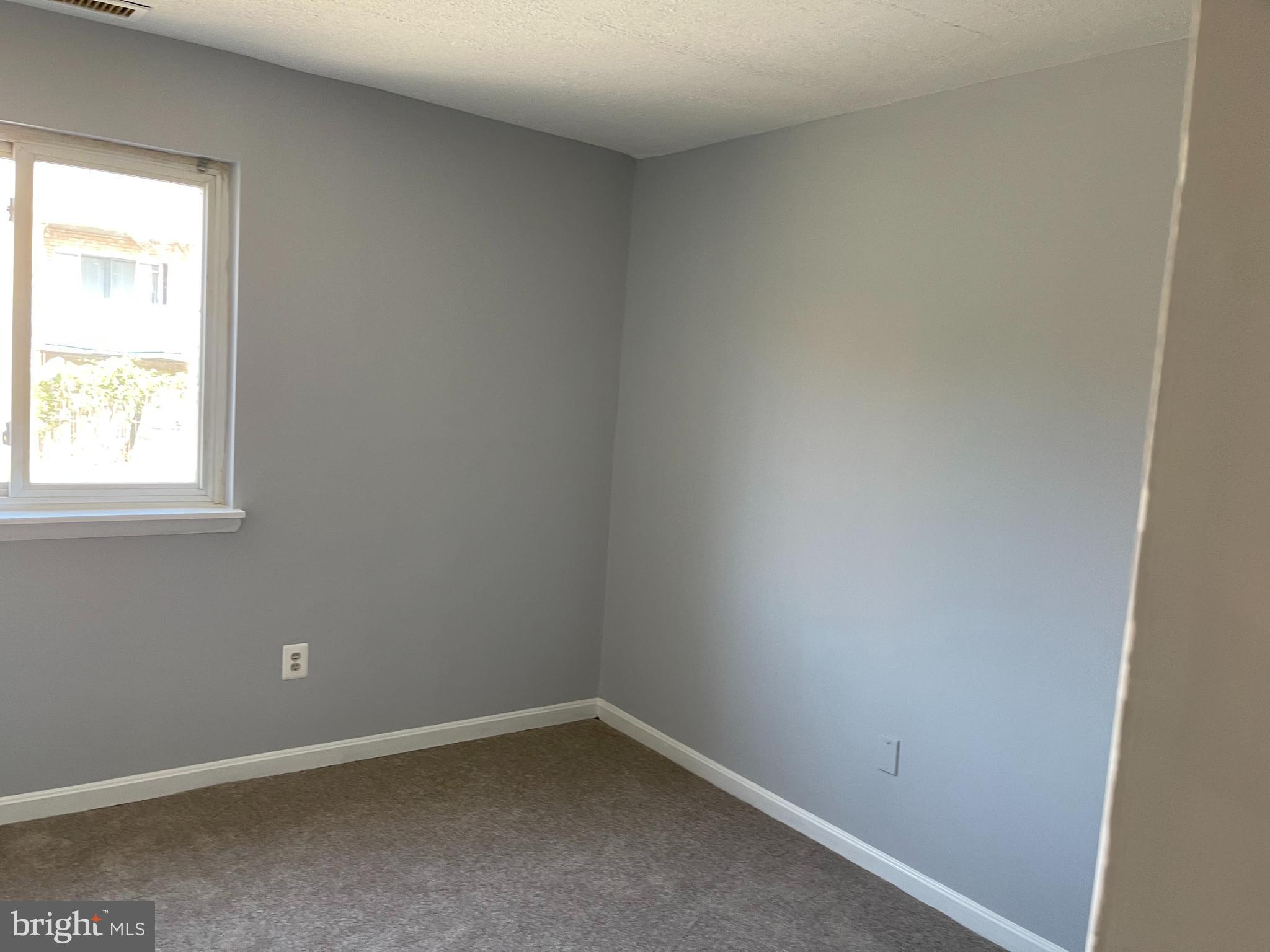 5106 F Street Southeast, Unit 8 Washington, DC 20019 - Photo 31 of 39 an empty room with a window