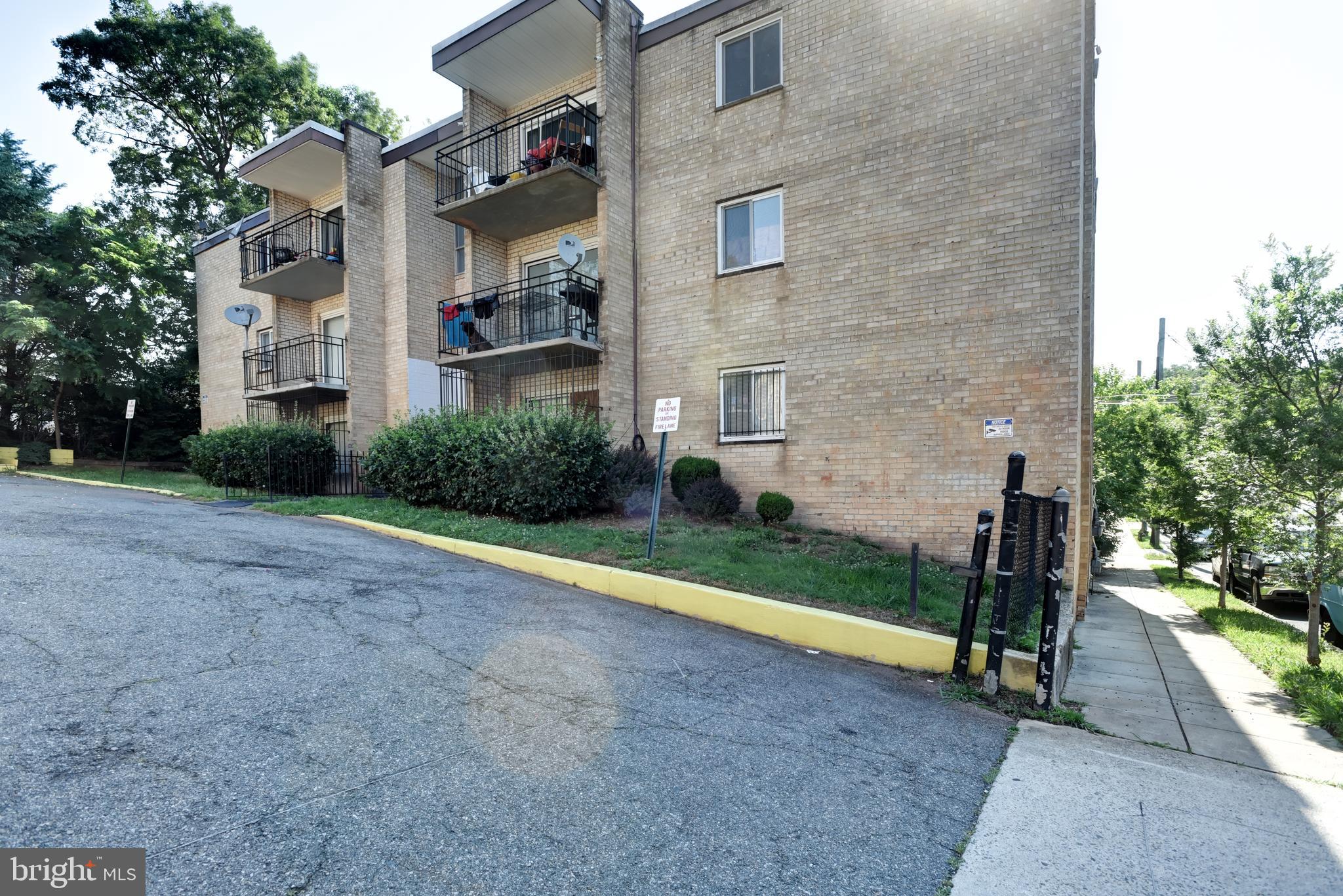 5106 F Street Southeast, Unit 8 Washington, DC 20019 - Photo 34 of 39 a front view of a house with garden