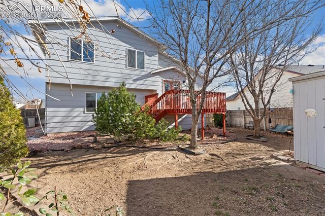 4948 Brant Road Colorado Springs, CO 80911 - Photo 26 of 28 Backyard Area - Roomy Side Yard Areas