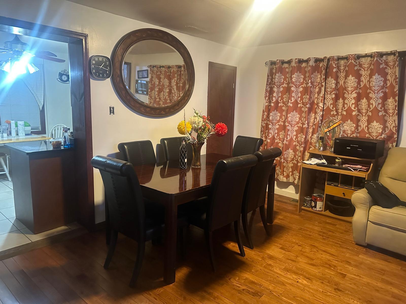 81-11 91st Avenue Queens, NY 11421 - Photo 2 of 15 a dining room with furniture and wooden floor