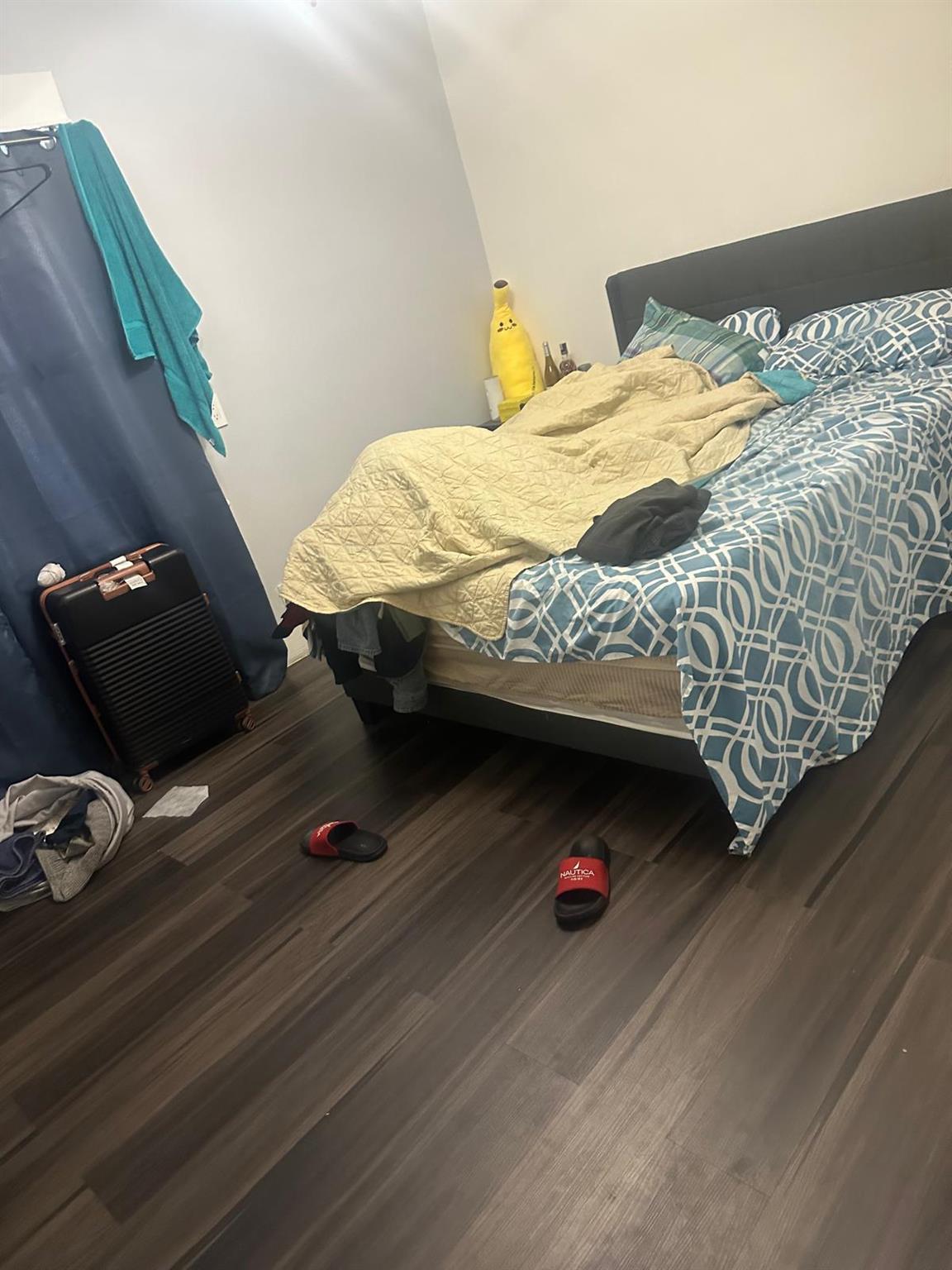 81-11 91st Avenue Queens, NY 11421 - Photo 8 of 15 a bedroom with a bed and a couch