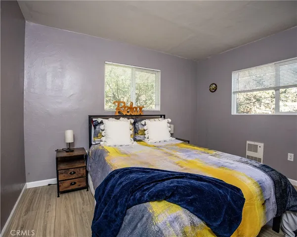 a bedroom with a bed and a tv