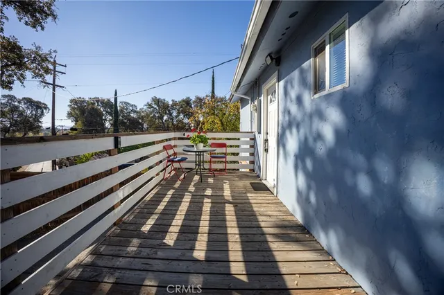 a view of a balcony with wooden floor