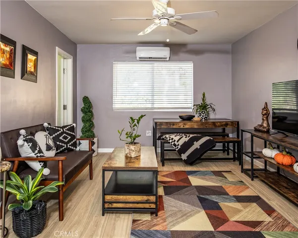 a living room with furniture and a rug