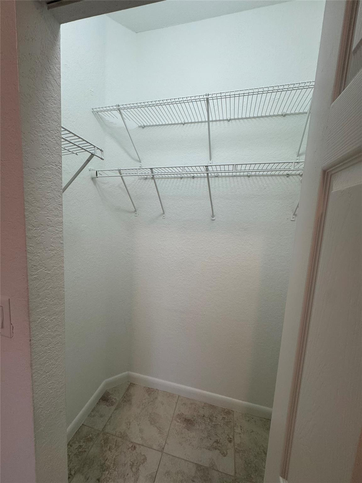 4903 Southwest 140th Terrace Miramar, FL 33027 - Photo 12 of 19 a view of small space with racks on the wall