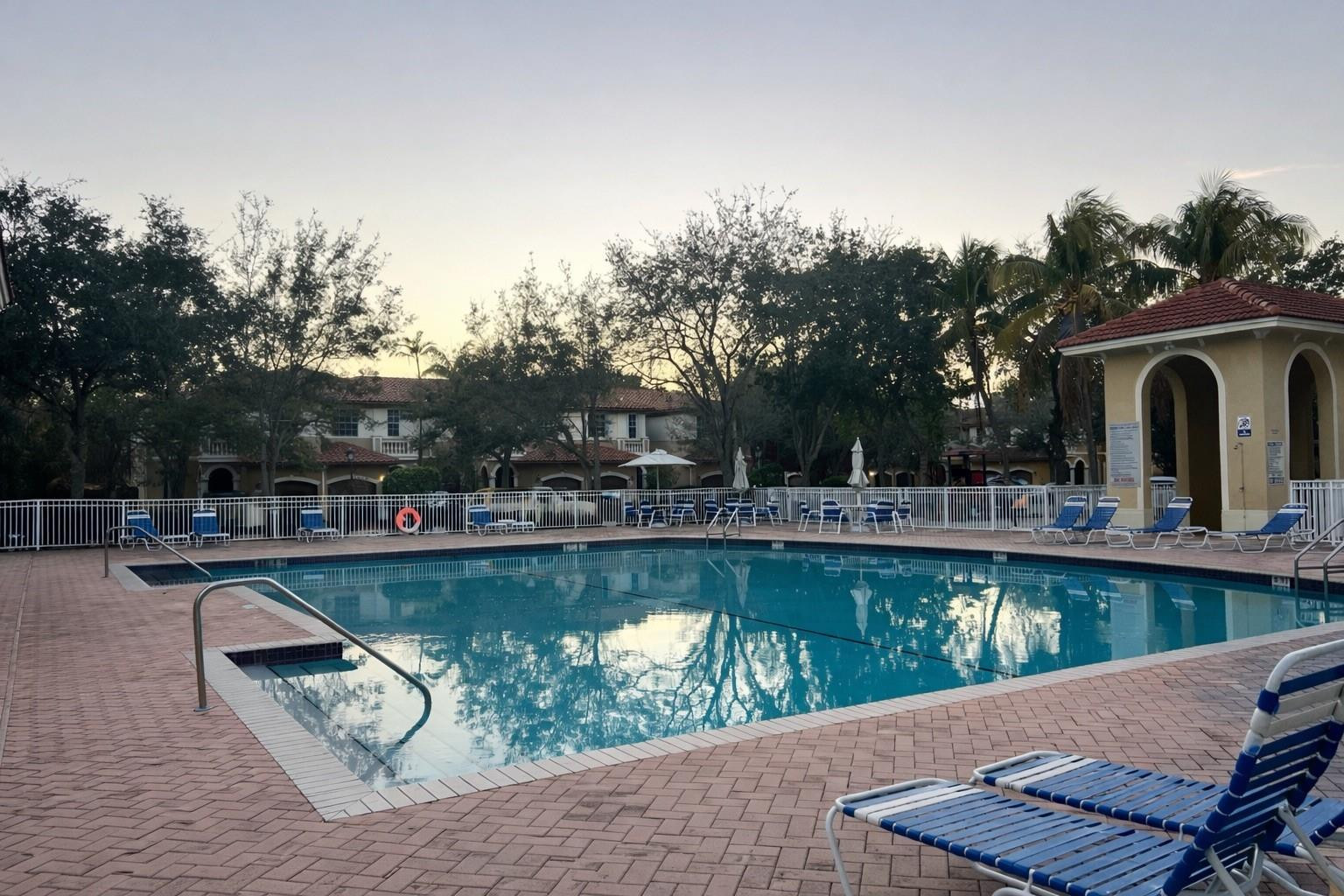 4903 Southwest 140th Terrace Miramar, FL 33027 - Photo 18 of 19 a view of a swimming pool with a patio and a garden