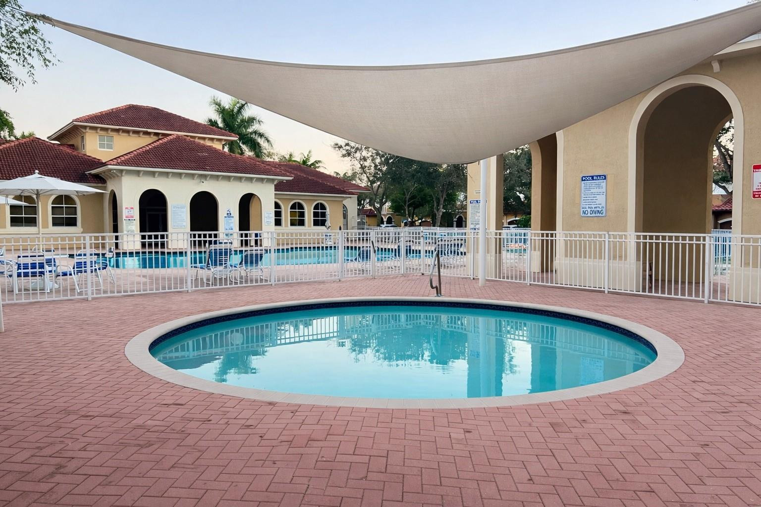 4903 Southwest 140th Terrace Miramar, FL 33027 - Photo 19 of 19 a view of swimming pool with outdoor seating