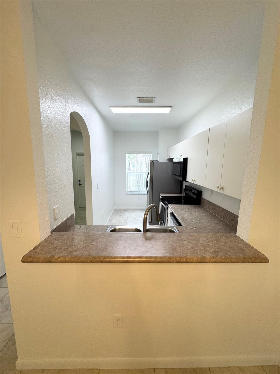 4903 Southwest 140th Terrace Miramar, FL 33027 - Photo 7 of 19 a view of kitchen island with furniture
