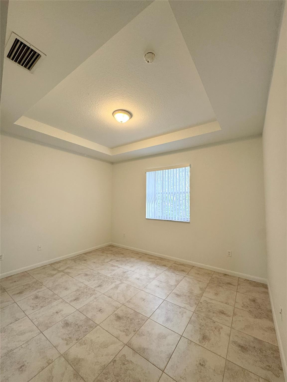 4903 Southwest 140th Terrace Miramar, FL 33027 - Photo 10 of 19 an empty room with a empty space and windows