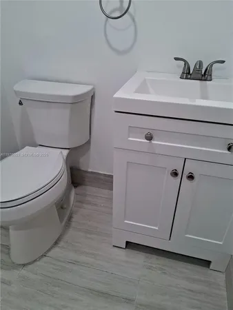a bathroom with a toilet and a sink