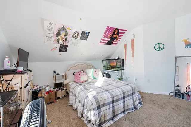 a bedroom with a bed and furniture