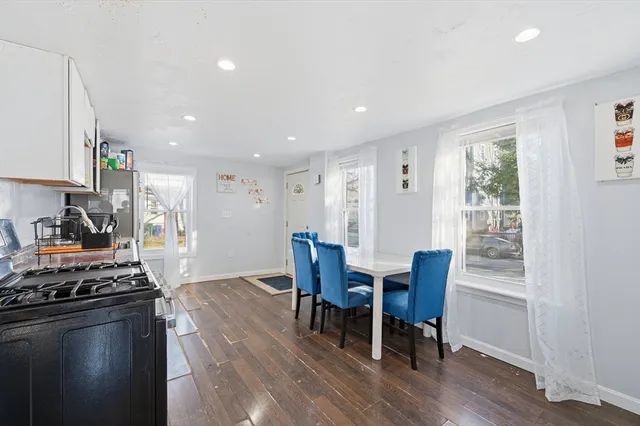 a view of a dining room with furniture window and wooden floor