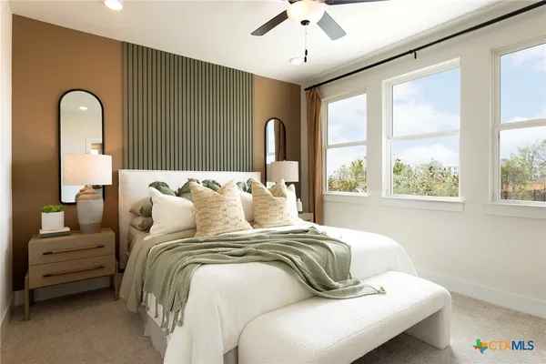 a bedroom with bed and a large window