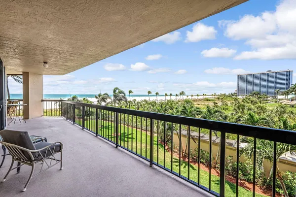 a view of a balcony with an ocean