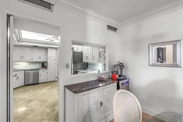a kitchen with stainless steel appliances granite countertop a sink and cabinets