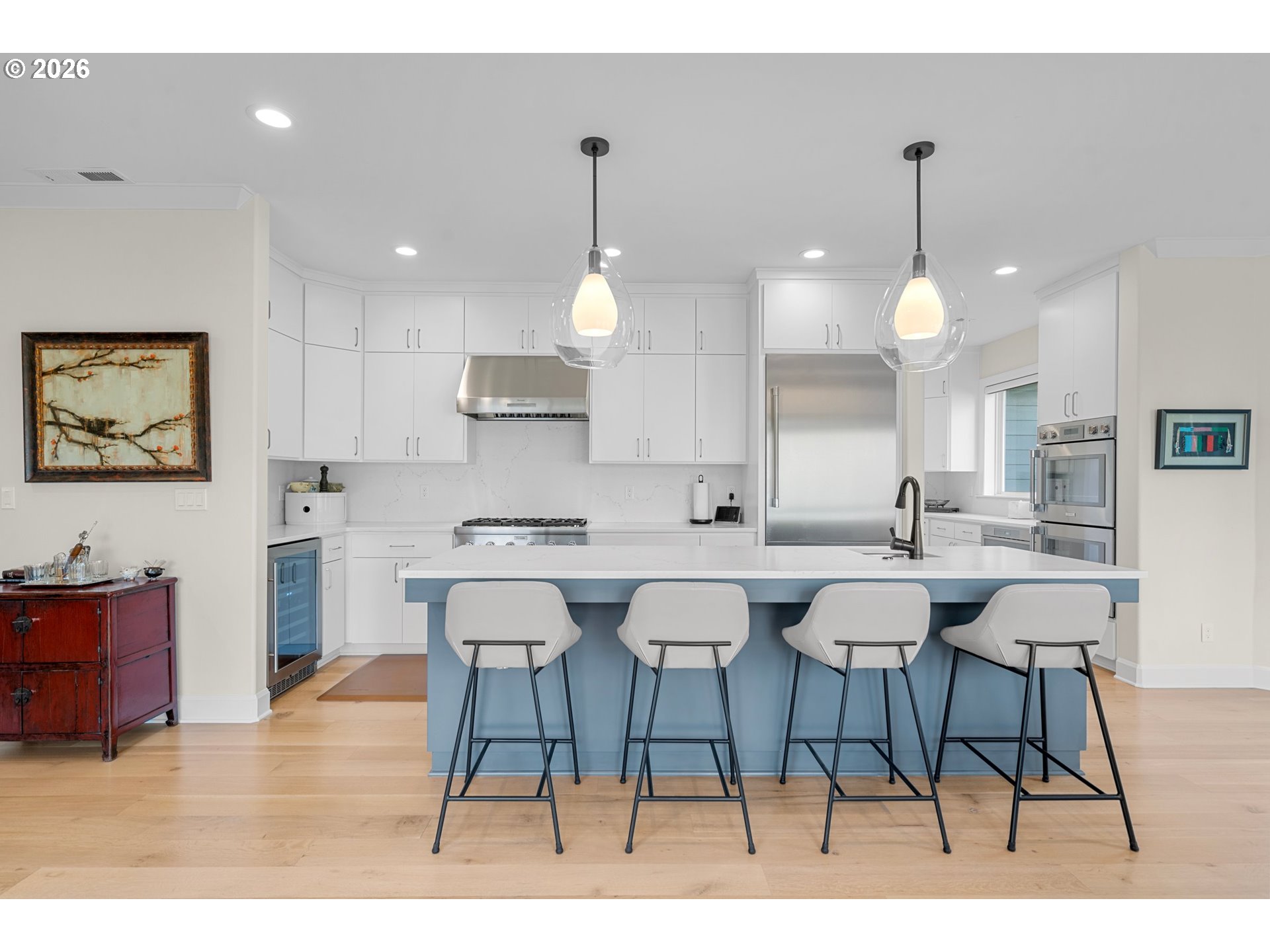 1716 Northwest Mill Pond Road Portland, OR 97229 - Photo 11 of 48 a kitchen with a dining table chairs wooden floor and appliances