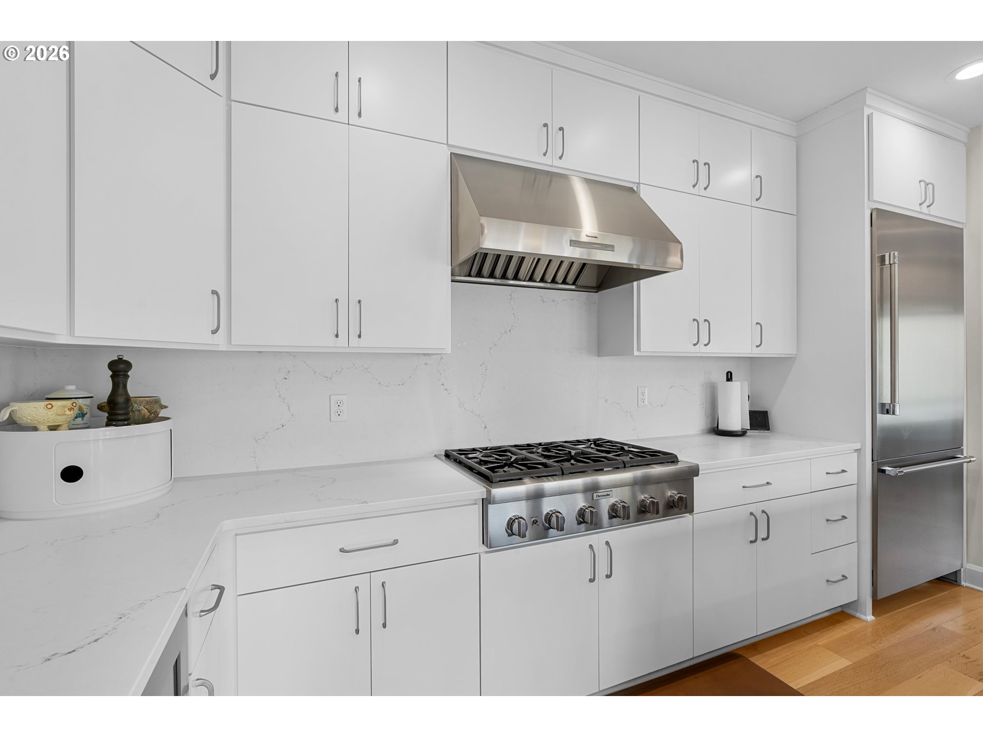 1716 Northwest Mill Pond Road Portland, OR 97229 - Photo 13 of 48 a kitchen with stainless steel appliances a sink stove and cabinets