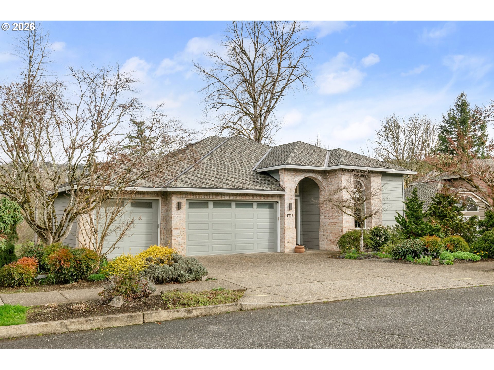 1716 Northwest Mill Pond Road Portland, OR 97229 - Photo 2 of 48 a front view of a house with a yard and garage